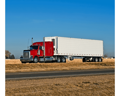 Picture of a red truck pulling a reefer trailer