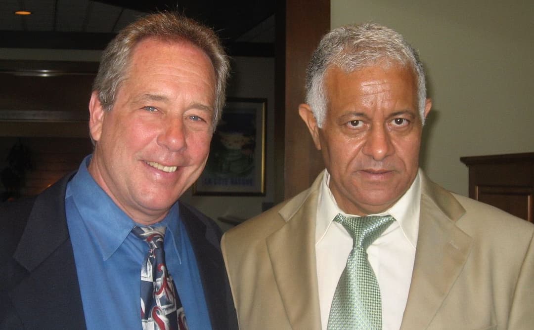 The founders Avner and John looking dapper in suits later in life after starting a successful business